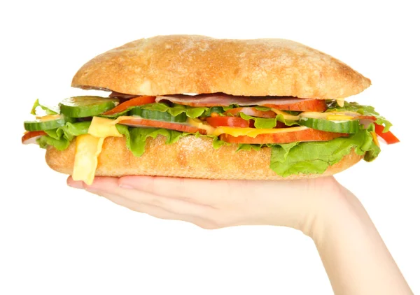 Φρέσκα και νόστιμα σάντουιτς με ζαμπόν και λαχανικά στα χέρια που απομονώνονται σε λευκό — Φωτογραφία Αρχείου