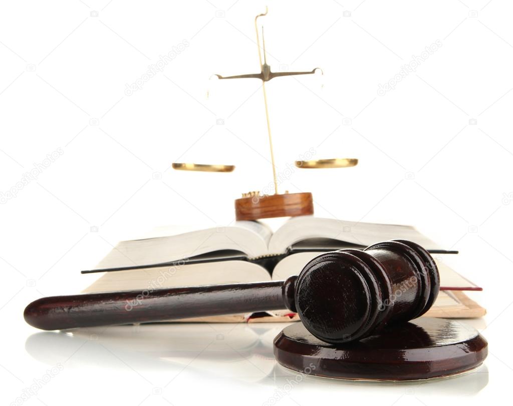 Wooden gavel, golden scales of justice and books isolated on white
