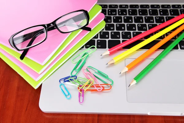 Laptop with stationery on table — Stock Photo, Image