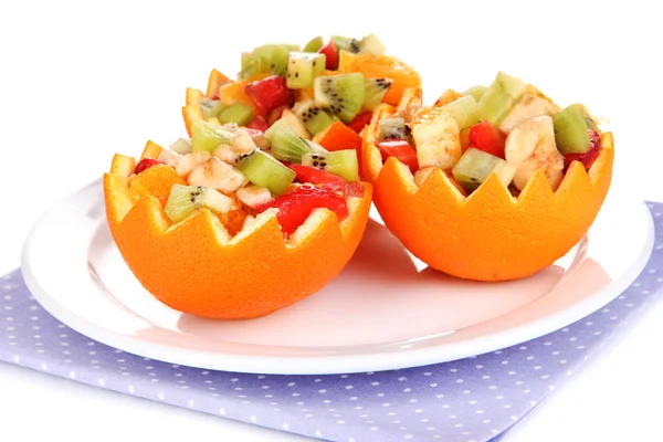 Fruit salad in hollowed-out orange isolated on white — Stock Photo, Image