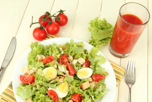 Caesar salad on blue plate, on color wooden background — Stock Photo, Image