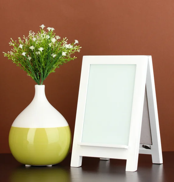 White photo frame for home decoration on brown background — Stock Photo, Image
