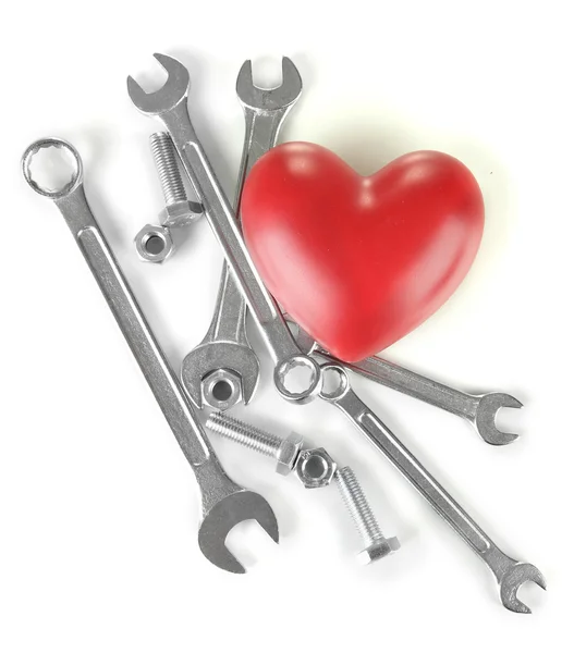 Corazón y herramientas. Concepto: Renovación del corazón. Aislado sobre blanco —  Fotos de Stock