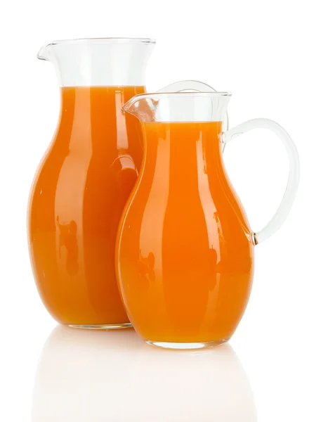 Orange juice in pitchers isolated on white — Stock Photo, Image