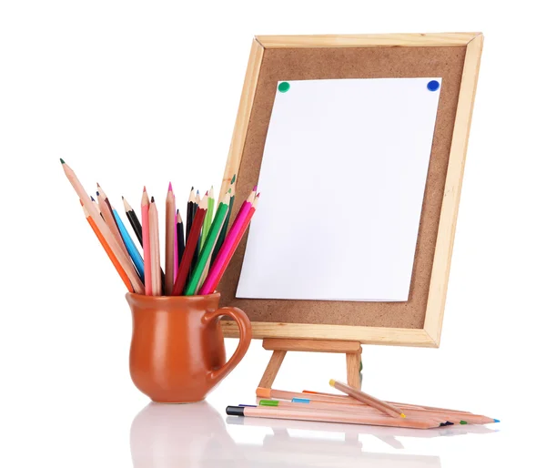 Small easel with sheet of paper with art supplies isolated on white — Stock Photo, Image