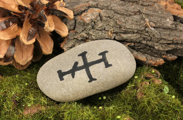 Fortune telling with symbols on stone close up — Stock Photo, Image