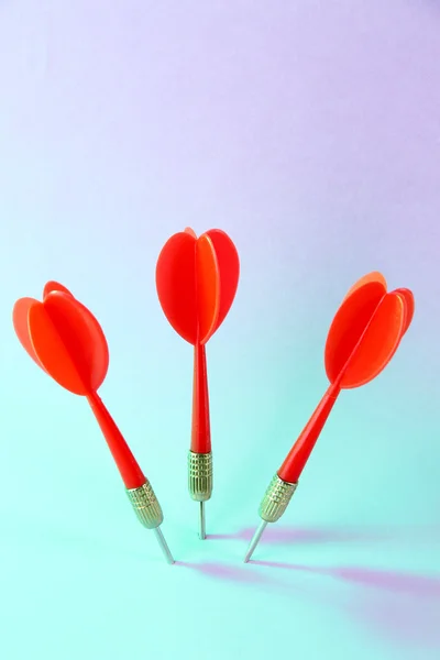 Darts on blue background — Stock Photo, Image