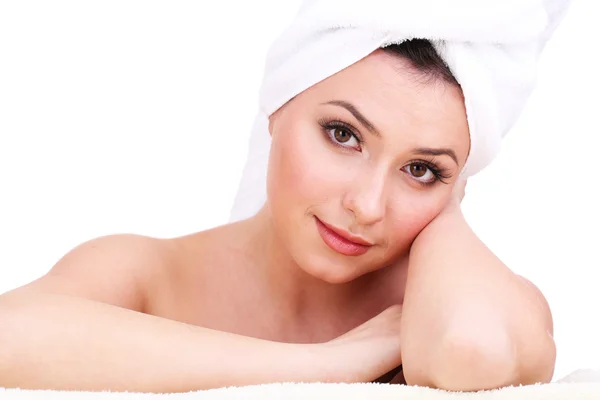 Beautiful young woman with towel on her head isolated on white — Stock Photo, Image