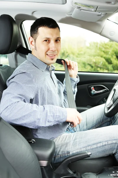 Portrait of young man sitting in the car — Stock Photo, Image