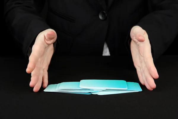 Hand with business cards. Concept: Business like poker game. Isolated on black — Stock Photo, Image