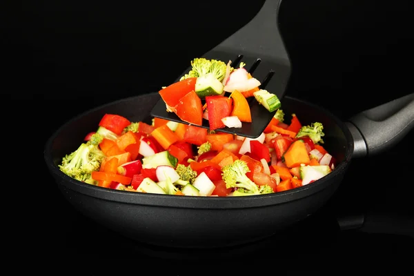 Vegetable ragout in pan, isolated on black — Stock Photo, Image