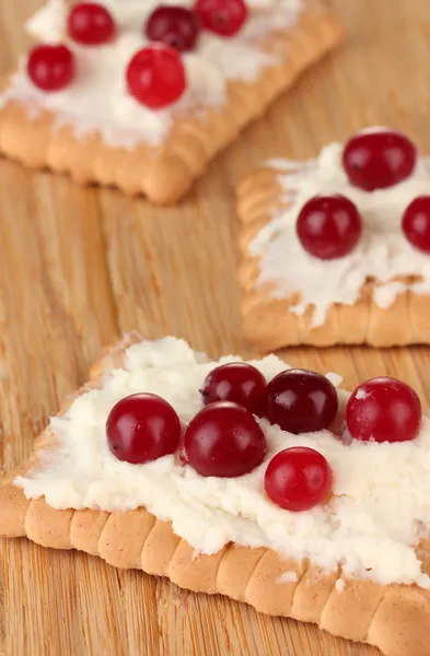 Cookie with cheese and cranberry, on wooden background Royalty Free Stock Photos