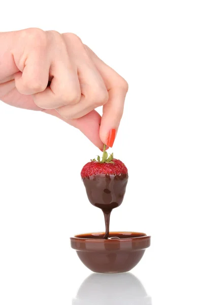 Hand holding strawberry in chocolate isolated on white — Stock Photo, Image
