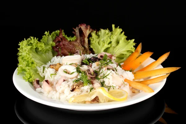 Delicatessen seafood salad with rice isolated on black — Stock Photo, Image