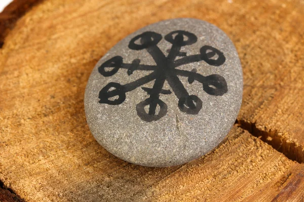 Fortune telling with symbols on stone on wooden background — Stock Photo, Image