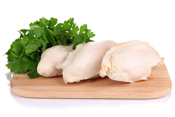 Boiled chicken breast on wooden cutting board with parsley isolated on white — Stock Photo, Image