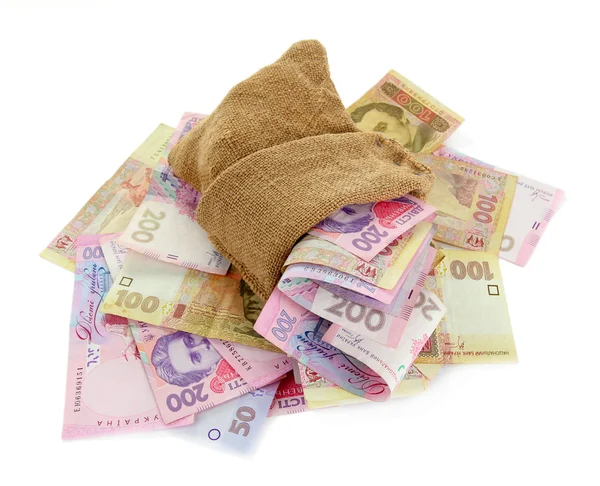 Burlap bag with Ukrainian money, isolated on white — Stock Photo, Image