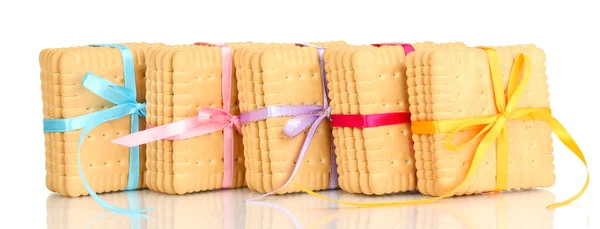 Sweet cookies tied with colorful ribbons isolated on white — Stock Photo, Image