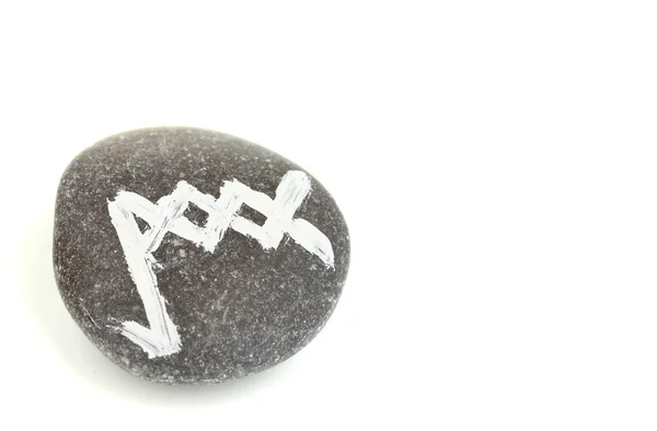 Servet taş üzerine beyaz izole sembollerle anlatmaya — Stok fotoğraf