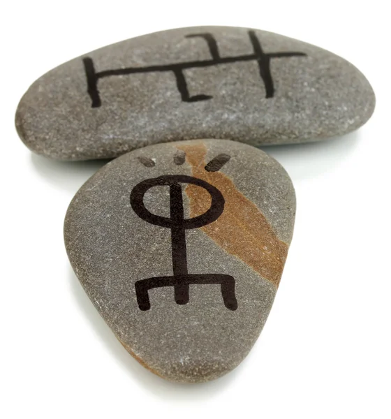 Fortune telling with symbols on stones isolated on white — Stock Photo, Image