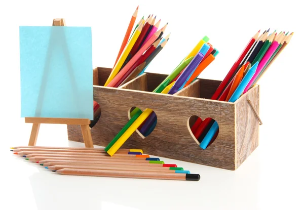 Different pencils in wooden crate and easel, isolated on white — Stock Photo, Image