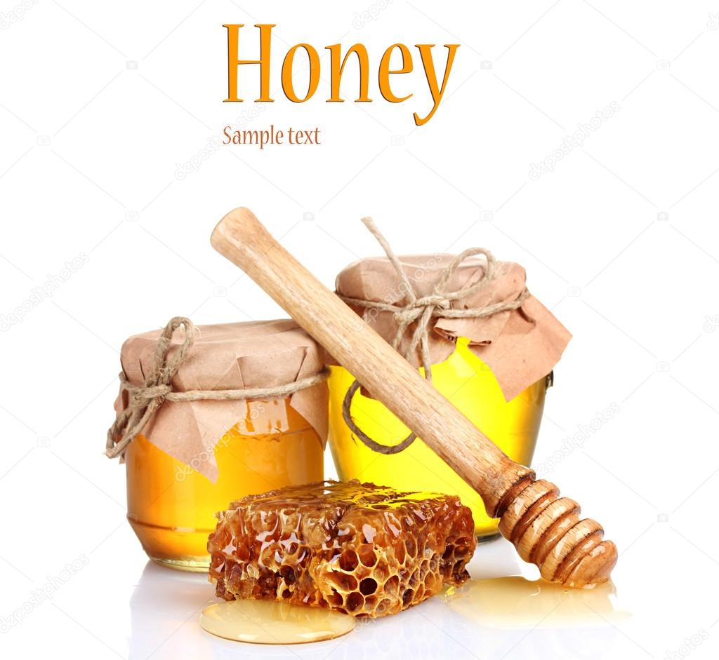 Two jars of honey and honeycombs isolated on white