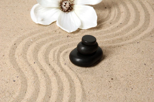 Zen garden with raked sand and round stones close up — Stock Photo, Image