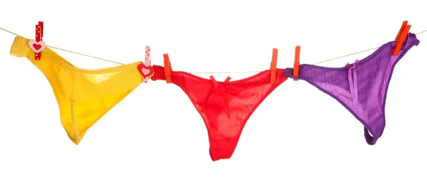 Women's panties hanging on rope isolated on white — Stock Photo, Image