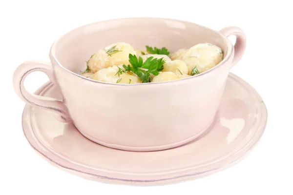 Tender young potatoes with sour cream and herbs in pan isolated on white — Stock Photo, Image