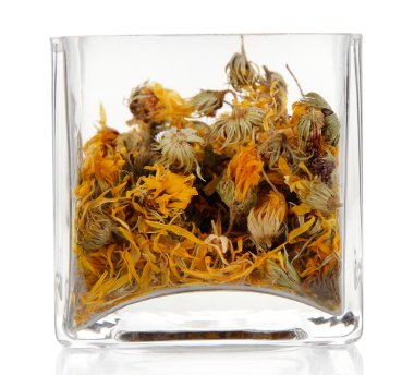 beyaz izole cam kap içinde kuru ot