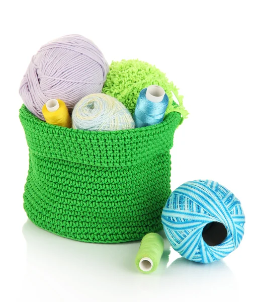 Colorful yarn for knitting in green basket isolated on white — Stock Photo, Image