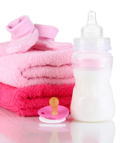 Bottle for milk with towels and nipple isolated on white — Stock Photo, Image