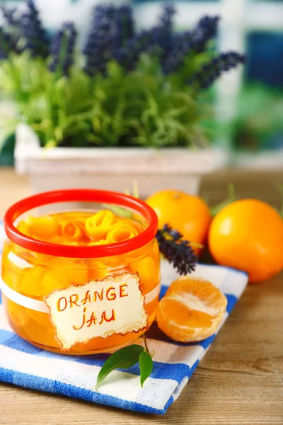 Orange jam with zest and tangerines, on wooden table — Stock Photo, Image