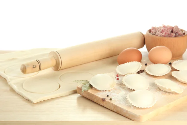 Raw dumplings and ingredients on wooden table, isolated on white — Stock Photo, Image