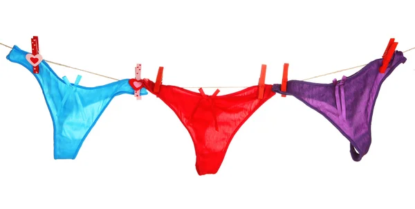 Women's panties hanging on rope isolated on white — Stock Photo, Image