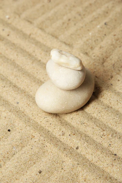 Zen garden with raked sand and round stones close up — Stock Photo, Image