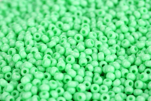 Lots beads mint color closeup background — Stock Photo, Image