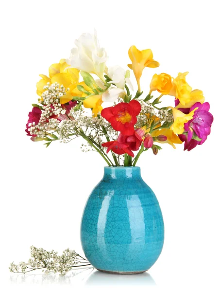 Beautiful bouquet of freesia in blue vase isolated on white — Stok fotoğraf