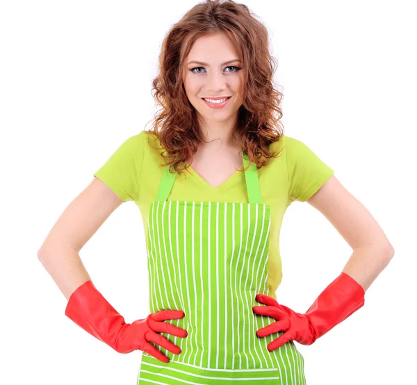 Young woman wearing green apron and rubber gloves, isolated on white — Stock Photo, Image