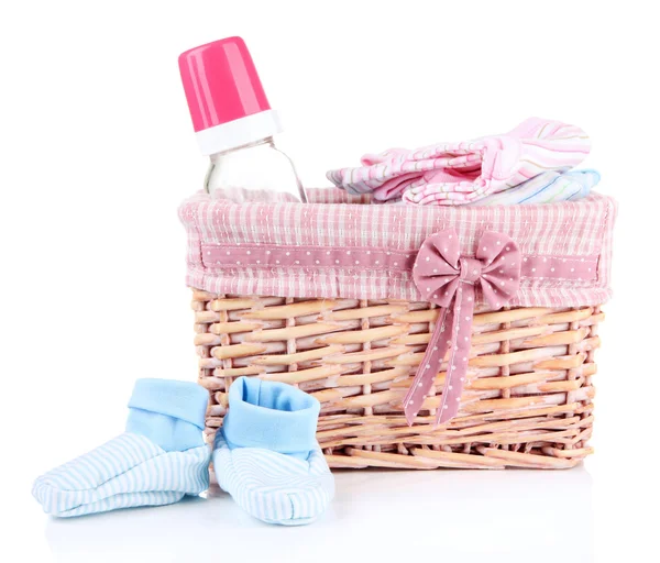 Beautiful basket of baby clothes isolated on white — Stock Photo, Image