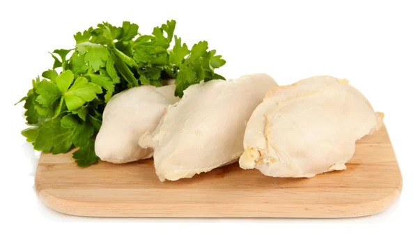 Peito de frango cozido em tábua de corte de madeira com salsa isolada em branco — Fotografia de Stock