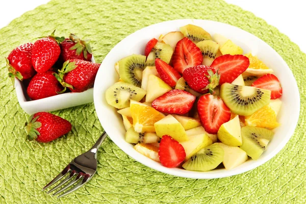 Useful fruit salad of fresh fruits and berries in bowl on napkin isolated on white — Stock Photo, Image