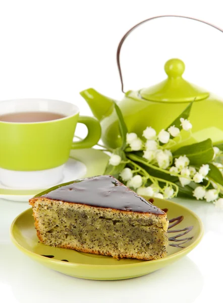 Delicious poppy seed cake with cup of tea isolated on white — Stock Photo, Image