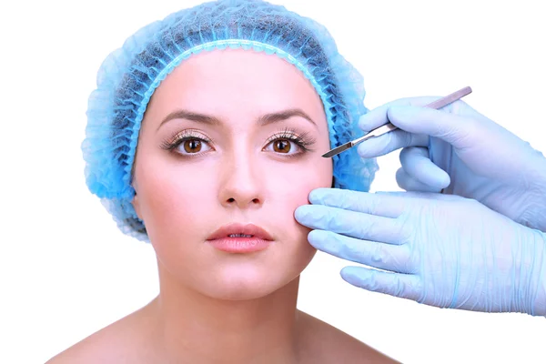 Cosmetic surgery with scalpel on young woman close up — Stock Photo, Image