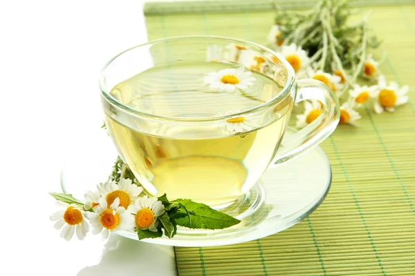 Cup of herbal tea with wild camomiles and mint, isolated on white — Stock Photo, Image