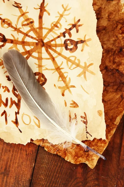 Old papers with symbols on wooden background — Stock Photo, Image