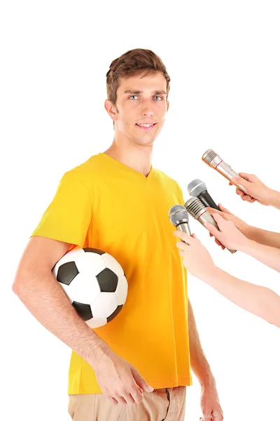 Entrevista com um jovem jogador de futebol, isolado em branco — Fotografia de Stock