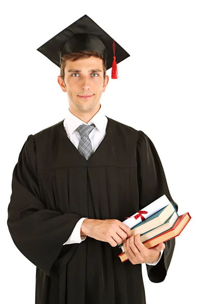 Young graduation man holding diploma and books, isolated on white — Stock Photo, Image