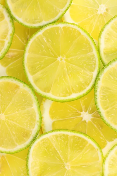 Lime och citron skivor bakgrund — Stockfoto