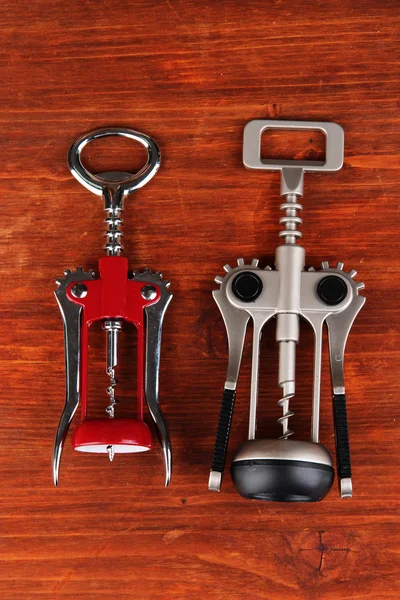 Two corkscrews on wooden background — Stock Photo, Image